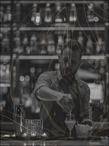 Bartender crafting a cocktail with bar tools